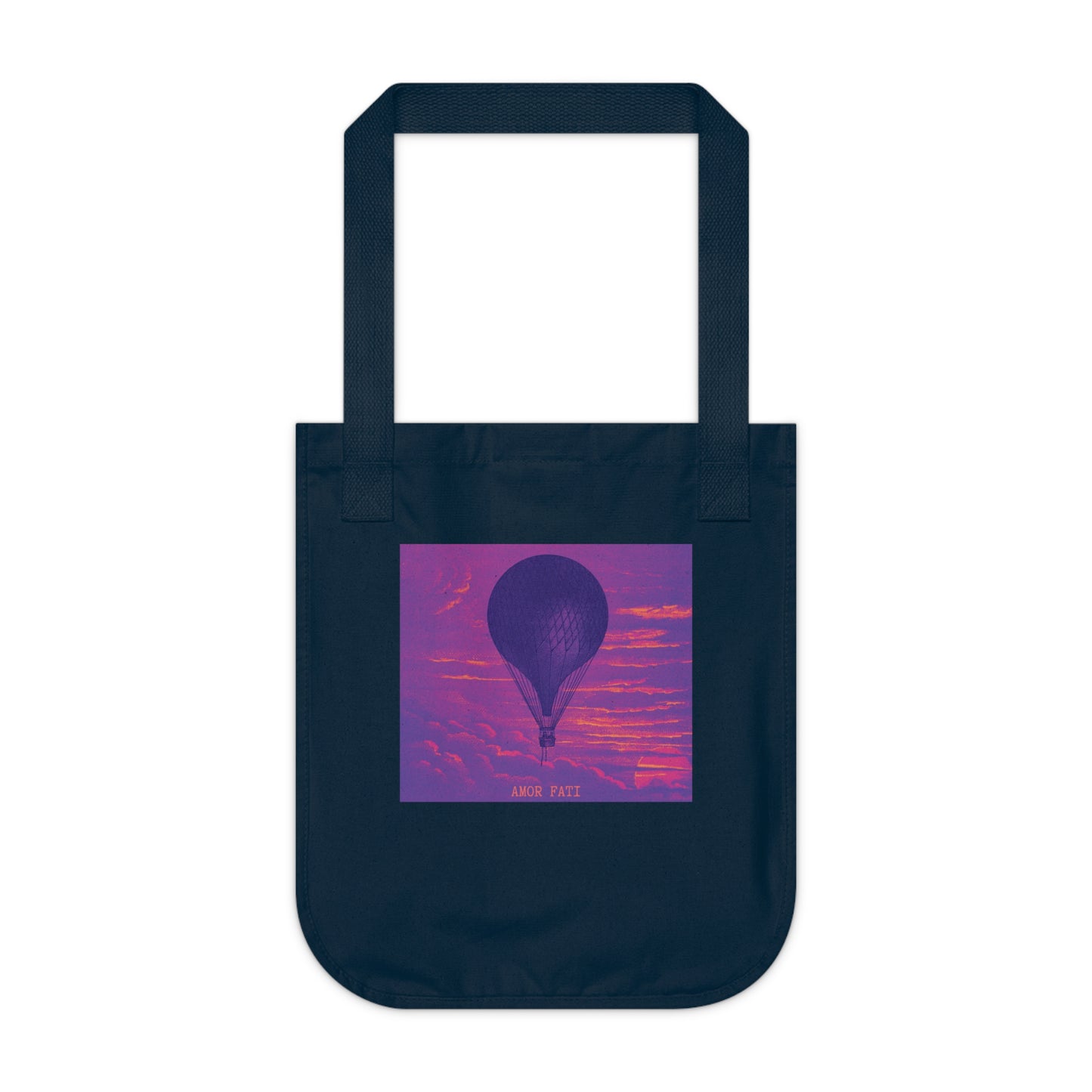 Navy canvas tote bag, front view, featuring a dark hot air balloon against a vivid purple and pink sky, with the text "AMOR FATI" beneath.