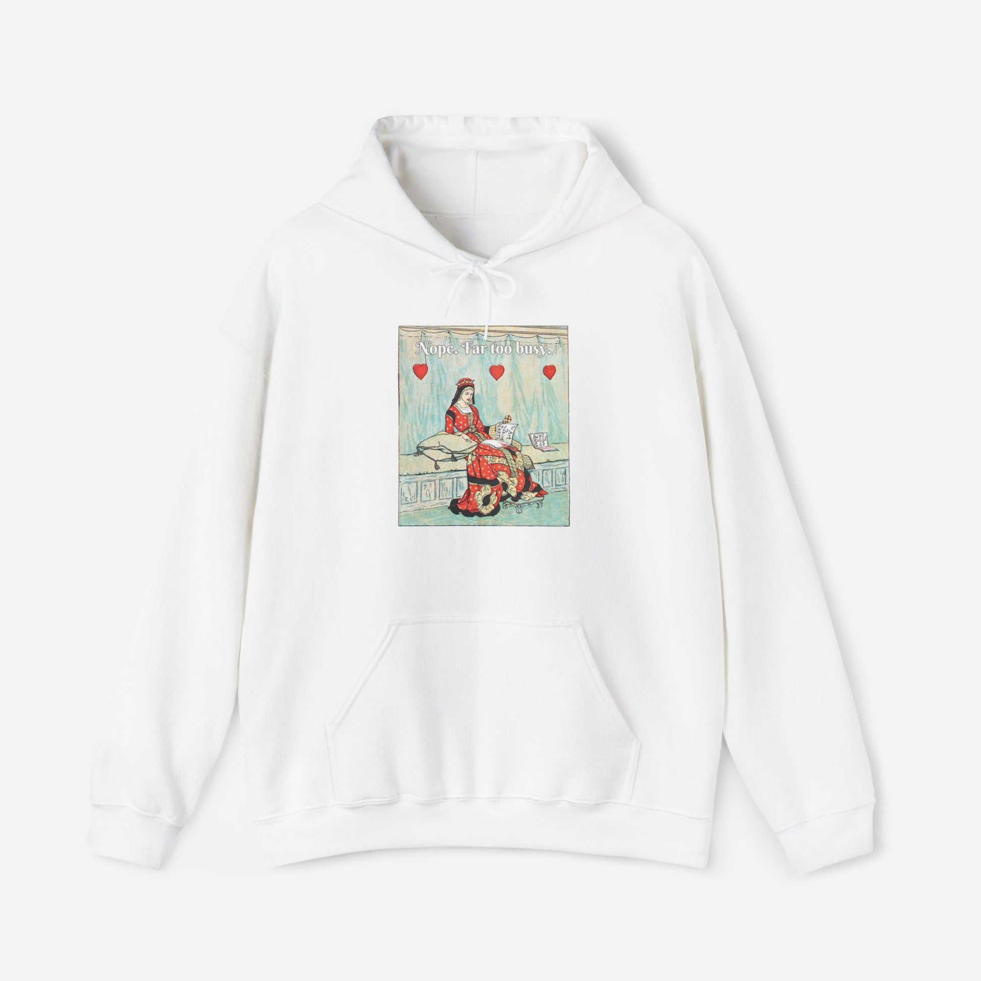 A white hoodie with a vintage illustration of the Queen of Hearts lounging on a bench reading The Art of Making Tarts. Above her the text reads "Nope. Far too busy."