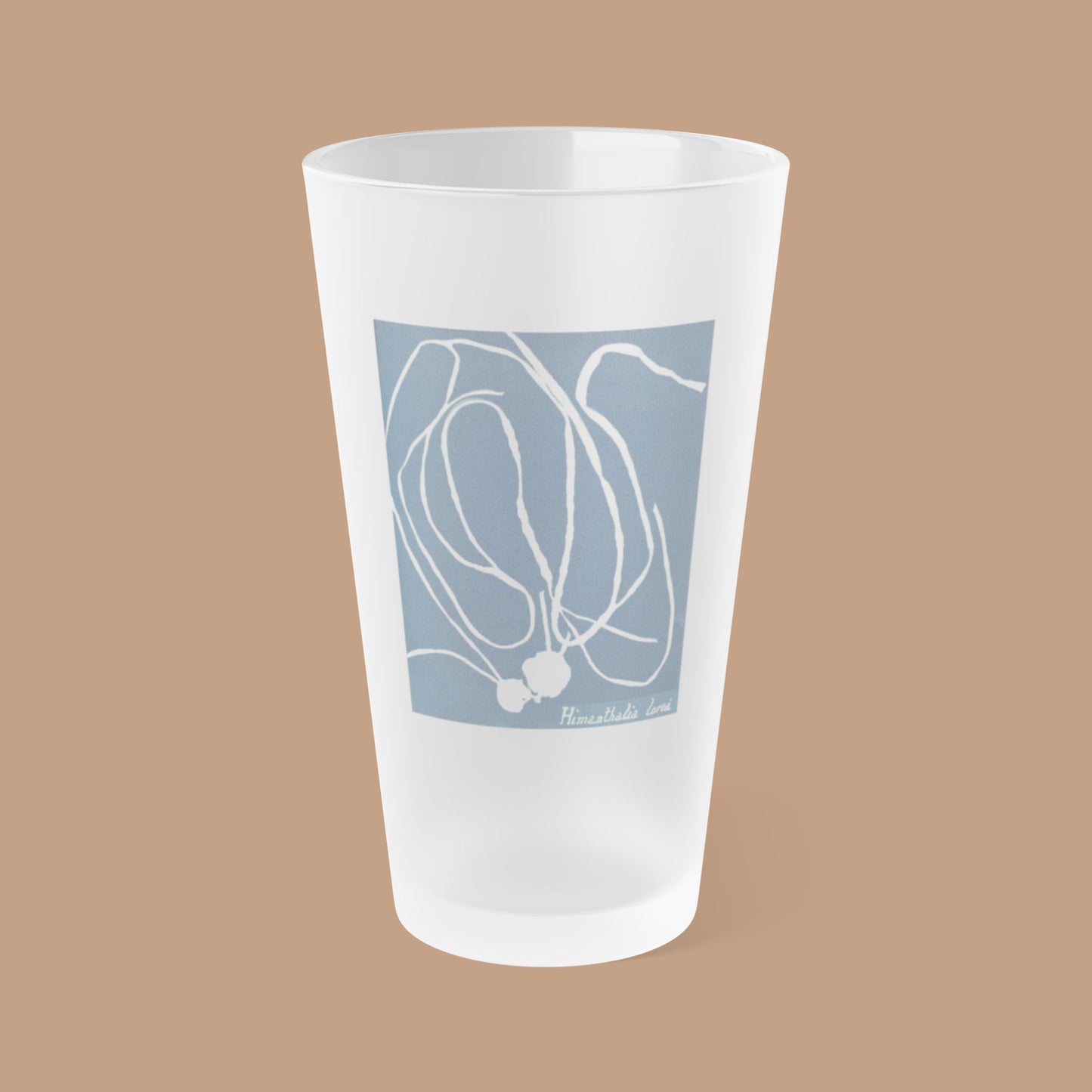 Frosted pint glass featuring Anna Atkins' cyanotype of Himanthalia Lorea from the Sumac and Pine Blueprints from the Sea collection