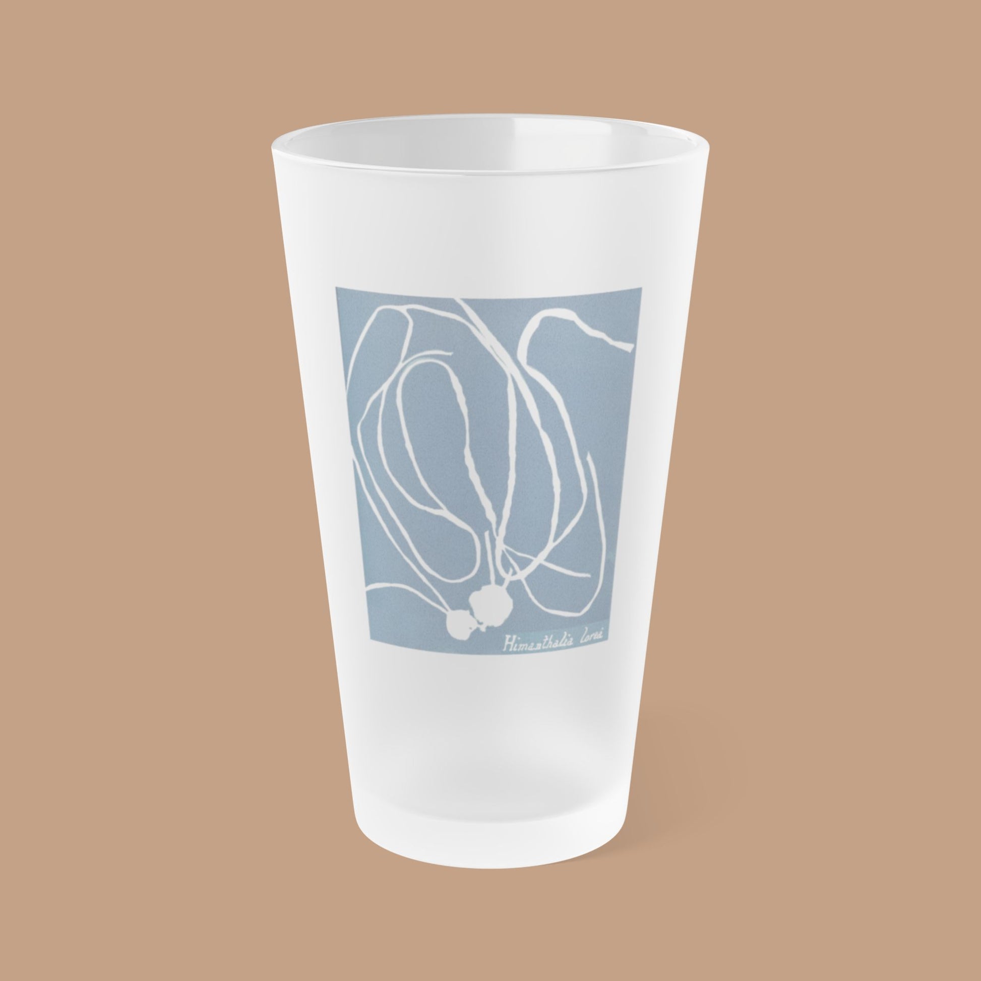 Frosted pint glass featuring Anna Atkins' cyanotype of Himanthalia Lorea from the Sumac and Pine Blueprints from the Sea collection