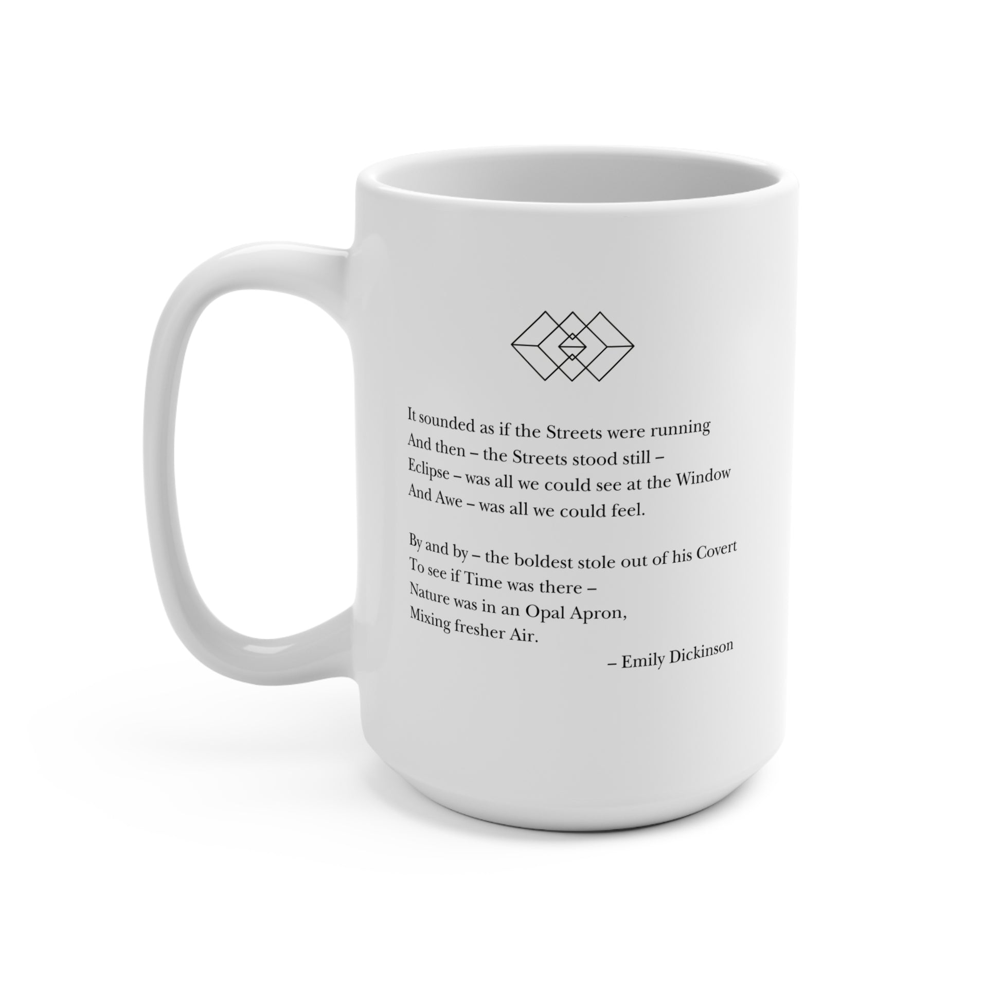 The back of a white mug, at the top there is a black outline of three interlocking diamonds. An Emily Dickinson poem about a solar eclipse is printed below the diamond symbol.