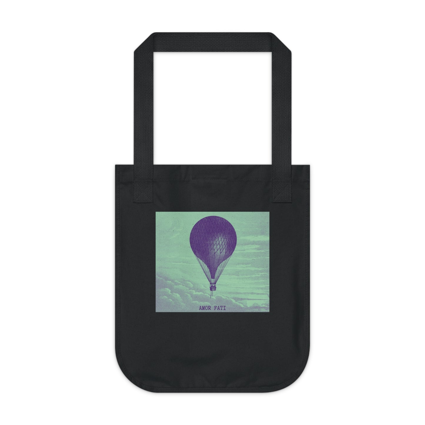 Black canvas tote bag, front view, featuring a dark hot air balloon against a mint green cloudy sky, with the text "AMOR FATI" beneath.