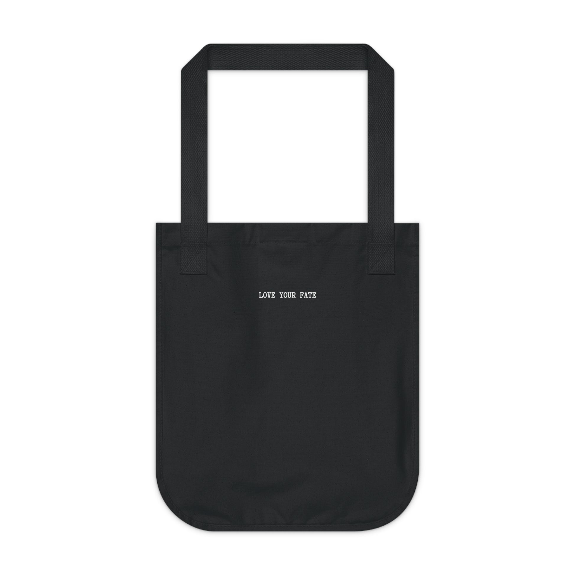 Black canvas tote bag, back view, with the words "LOVE YOUR FATE" printed in small, white, typewriter-style text across the center.