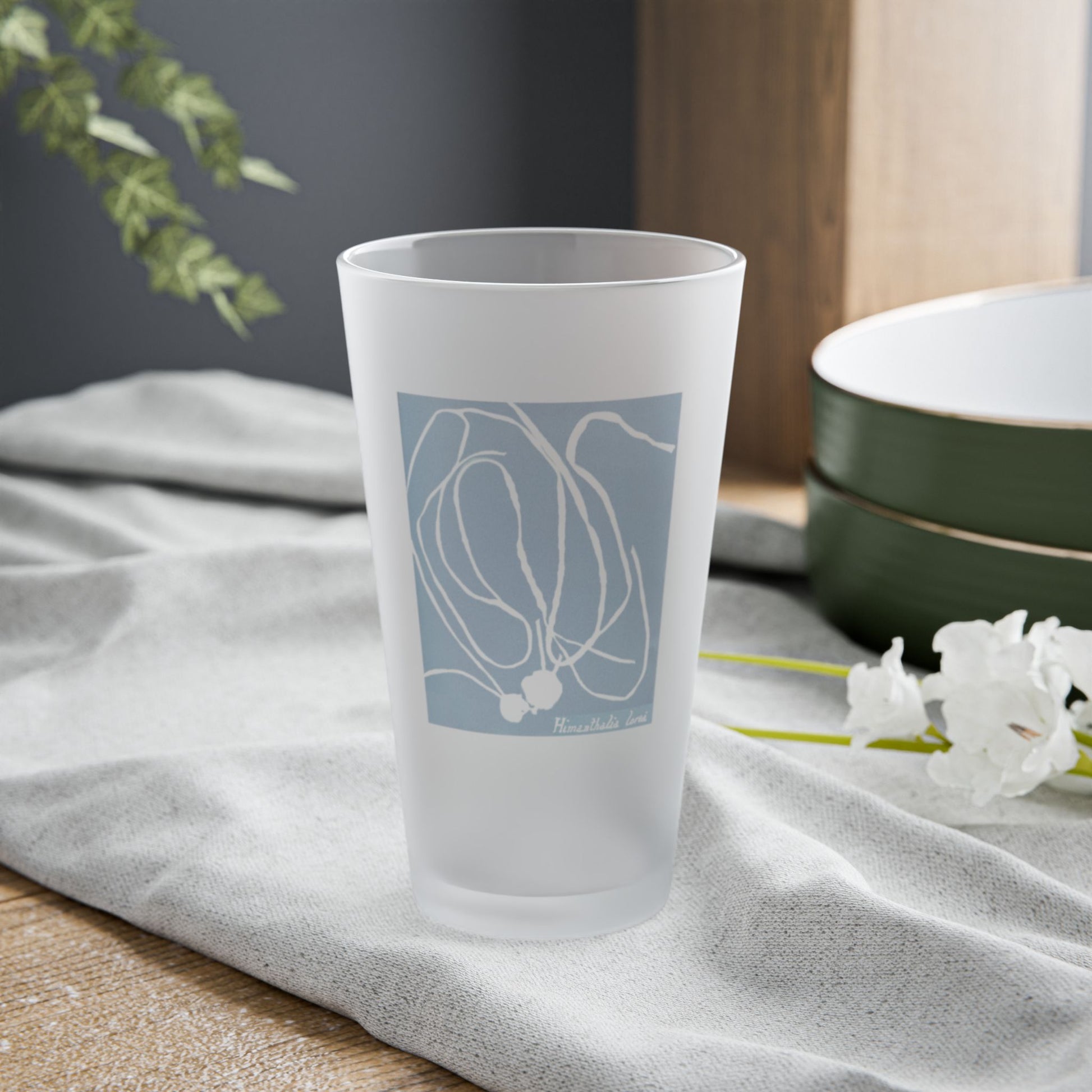 Frosted pint glass featuring Anna Atkins' cyanotype of Himanthalia Lorea from the Sumac and Pine Blueprints from the Sea collection